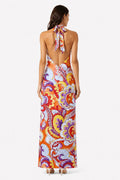 Woman wearing a colorful patterned dress with a white background