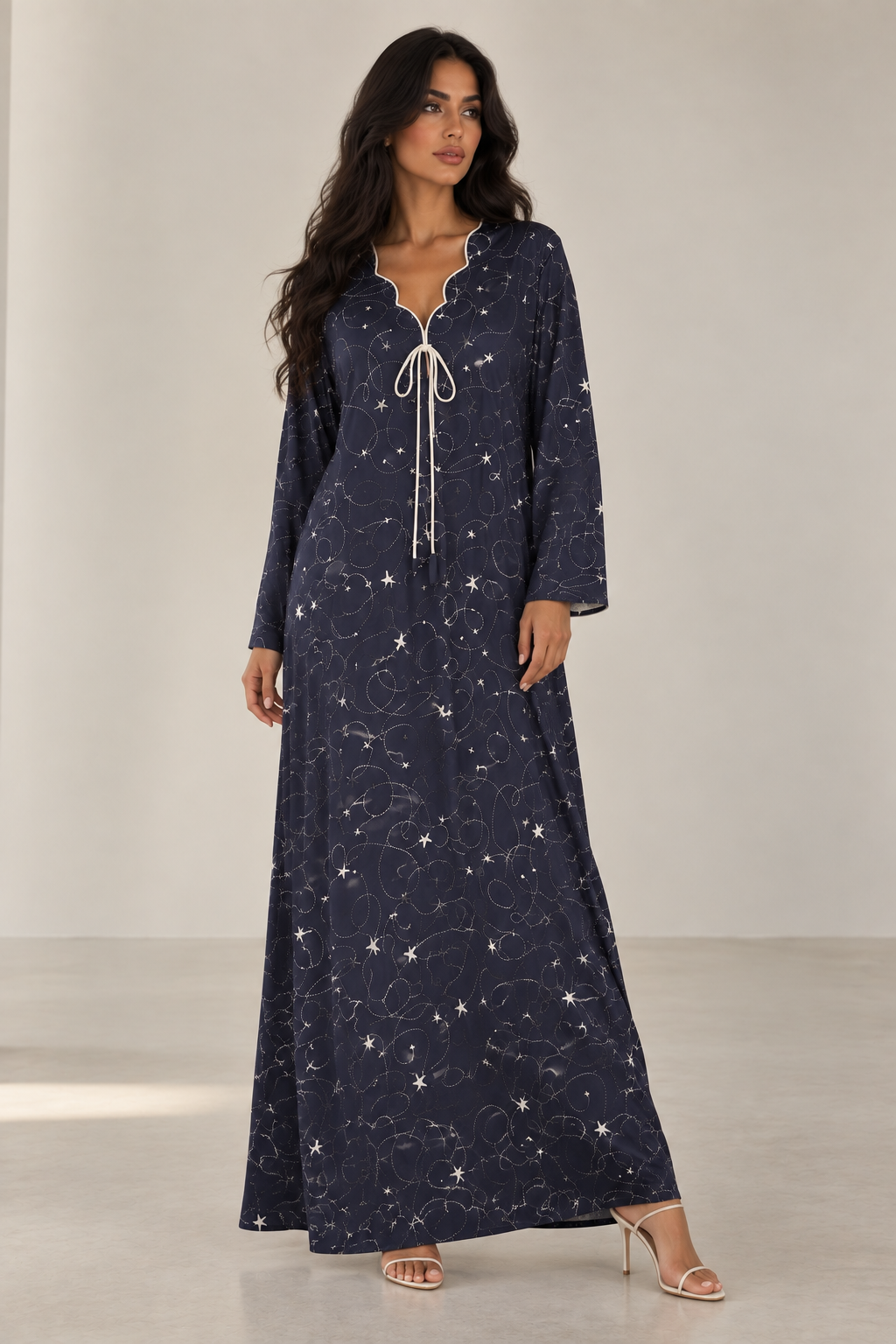 Everyday Edit — Navy long-sleeve dress with small scattered motifs and tie neckline.