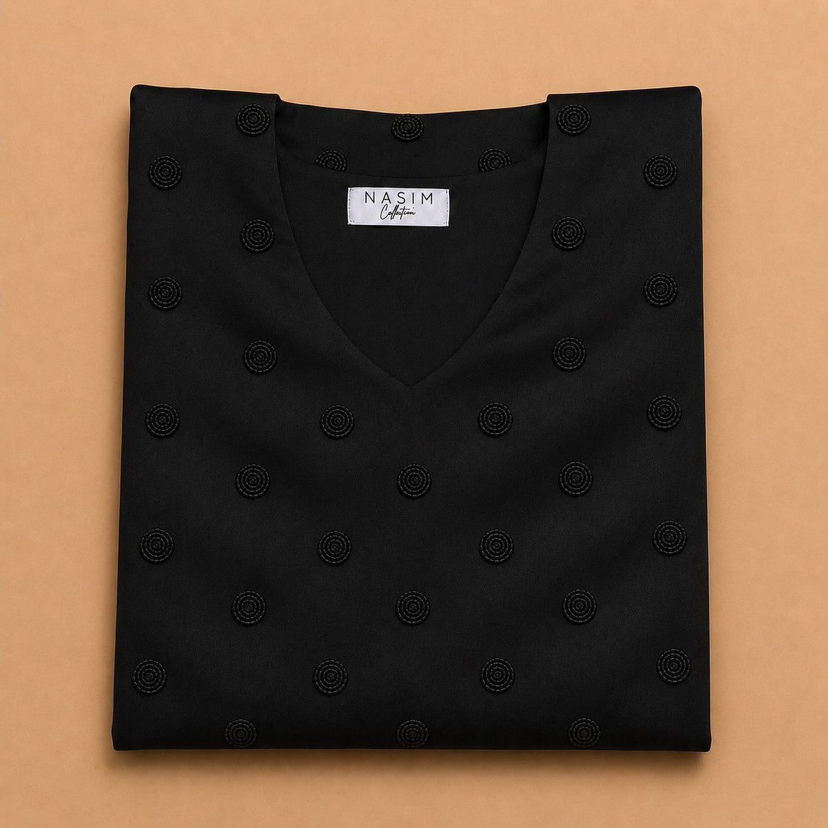 NC#MK13 — Folded black Mkhawar with circular motifs.
